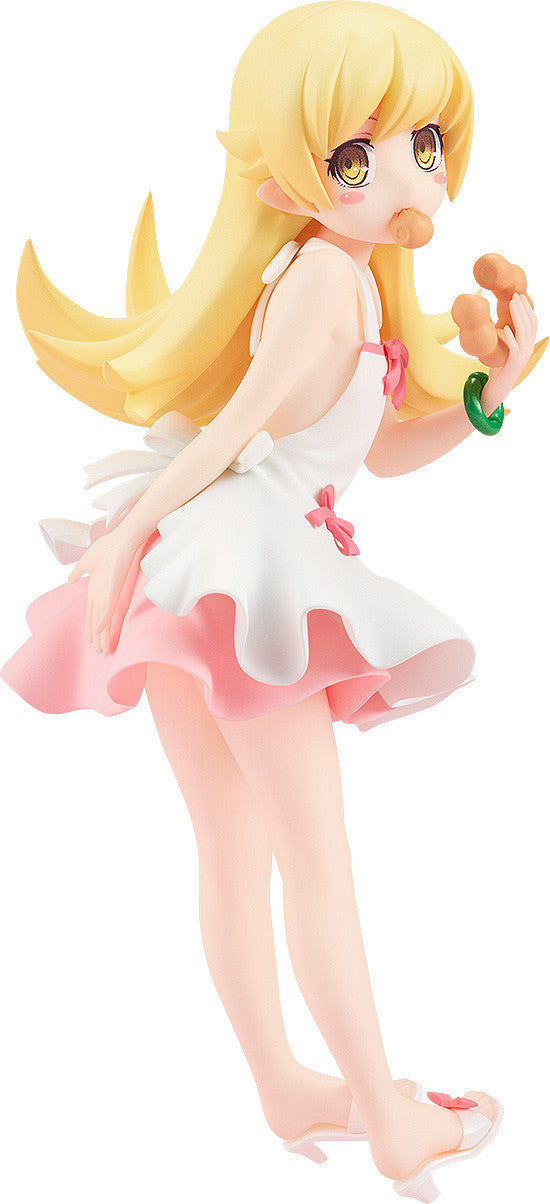 Blonde anime girl figure in a white and pink dress with a donut in her mouth, holding another