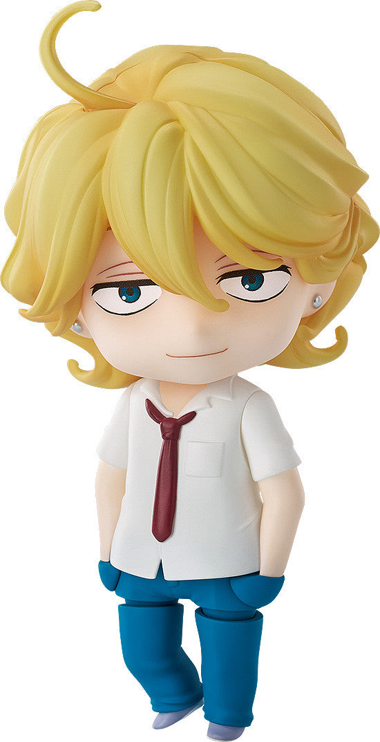 A Nendoroid figure of a blond character with a slight smirk, wearing a white shirt, red tie, and blue pants