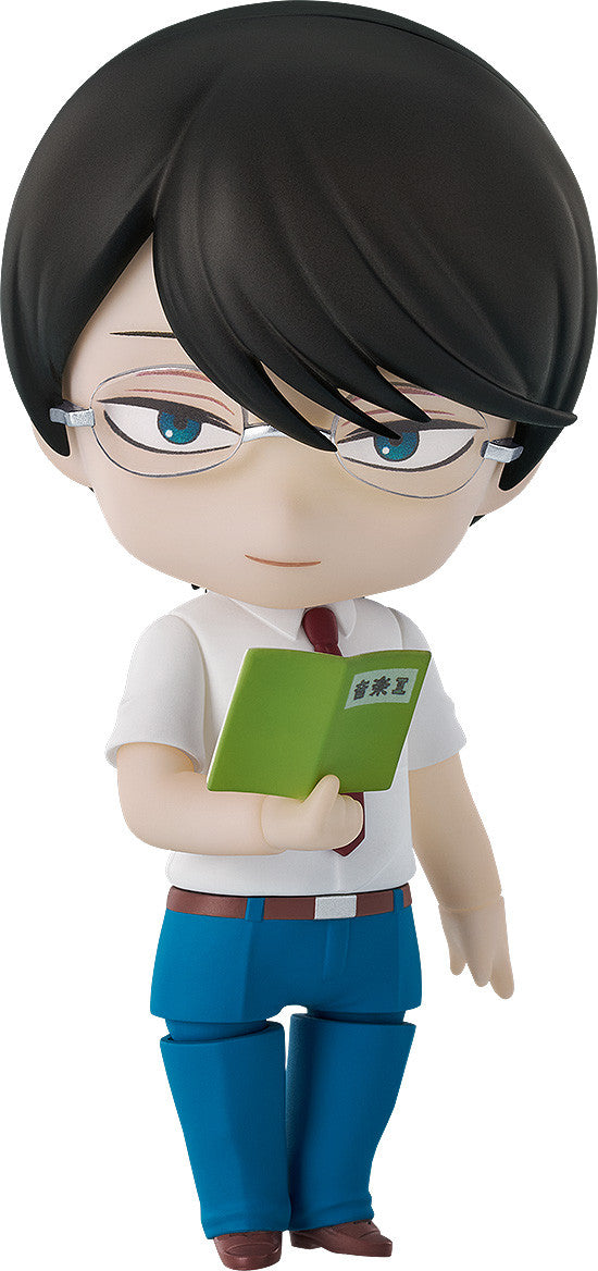 Nendoroid figure of a male character with black hair, glasses, white shirt, blue pants, holding a green book