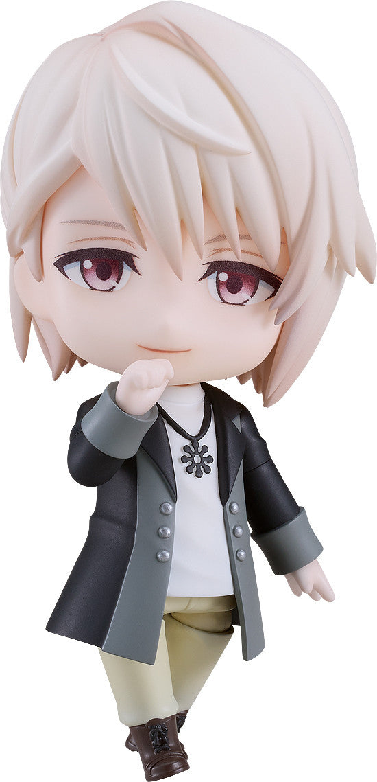 Nendoroid figure of a pale-haired character in a black coat, smiling thoughtfully with hand to chin.