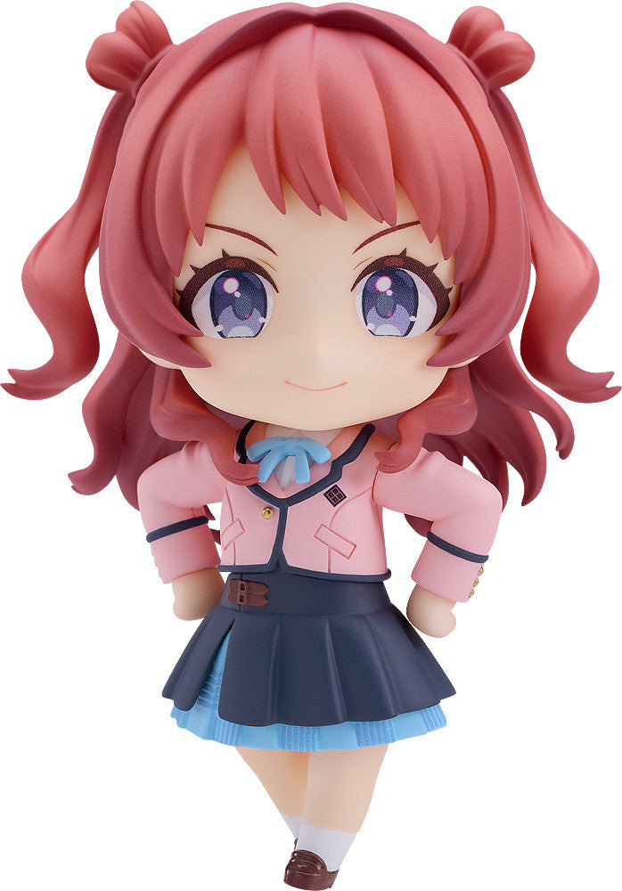 Good Smile Company The Idolm@Ster Nendoroid Saki Hanami figure with pink pigtails, blue-purple eyes, a pink blazer and dark blue skirt, posing cheerfully on white
