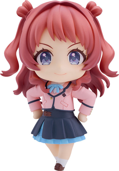 Good Smile Company The Idolm@Ster Nendoroid Saki Hanami figure with pink pigtails, blue-purple eyes, a pink blazer and dark blue skirt, posing cheerfully on white