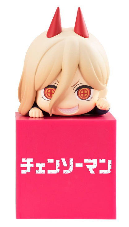Chibi-style anime figurine of Power from Chainsaw Man peeking over a bright pink cube with the series title in white Japanese text