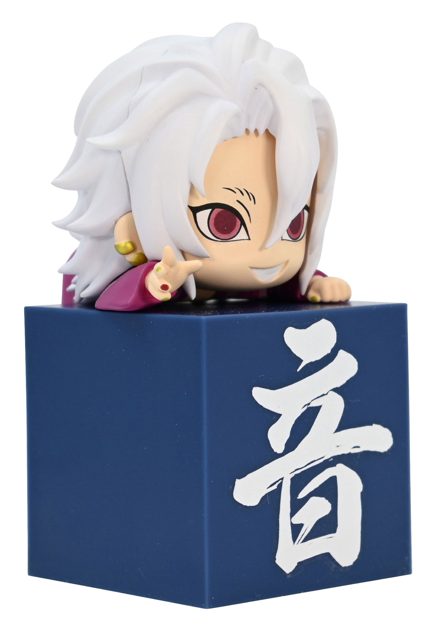 Chibi anime figurine with white hair and red eyes peeking over a dark blue block with white Japanese kanji