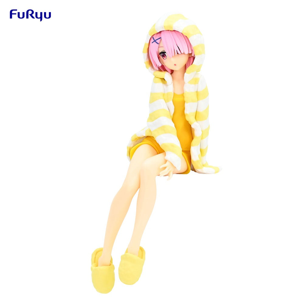 Anime figure of a girl sitting. She wears a yellow and white striped hooded robe and yellow slippers