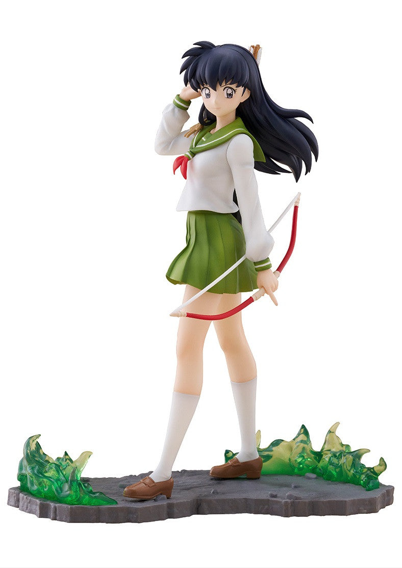 Kagome Higurashi anime figure in school uniform, holding a bow, with green energy effects.
