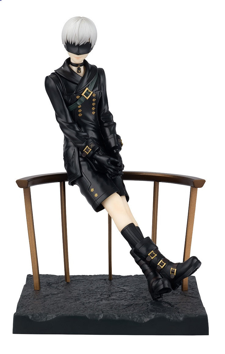 Blindfolded Nier Automata 9S figure in black attire sits on a wooden rail, hands clasped, legs crossed