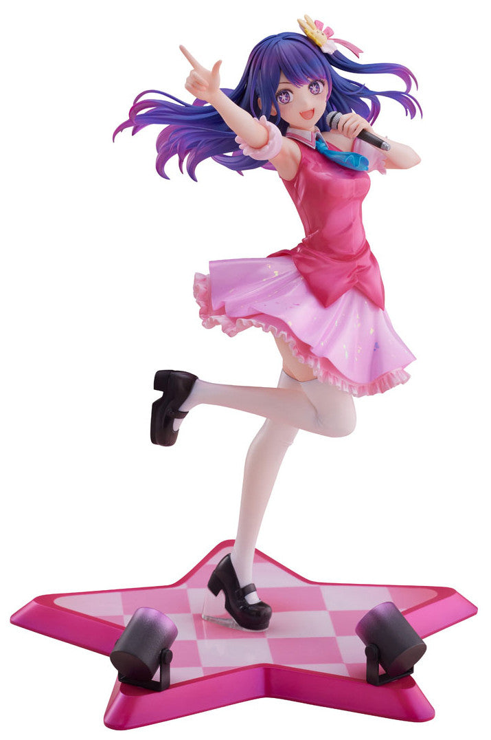 Anime idol figure in a pink tiered dress with purple hair and a blue tie standing on a pink star stage base