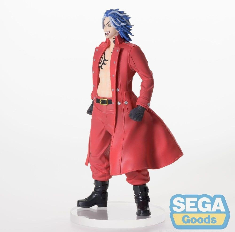 Character figure with blue hair and a grin, wearing an open red trench coat and showing a chest tattoo