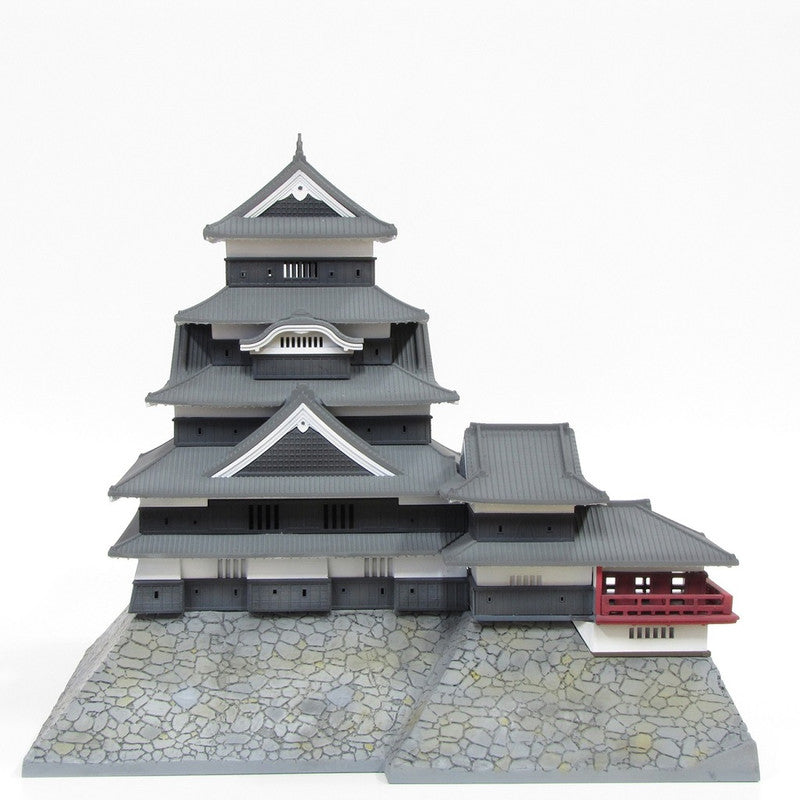 Highly detailed plastic model kit of Kumamoto Castle with multi-tiered roofs and stone base