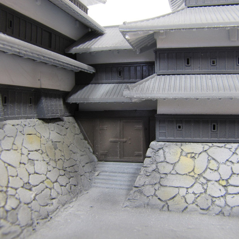 Detailed model of a Japanese castle exterior showing the stone wall and entrance gate