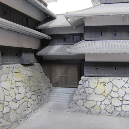 Detailed model of a Japanese castle exterior showing the stone wall and entrance gate