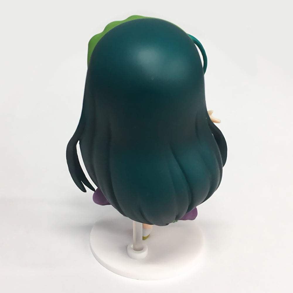Back view of a teal-haired anime-style female figure