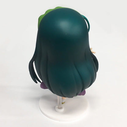 Back view of a teal-haired anime-style female figure