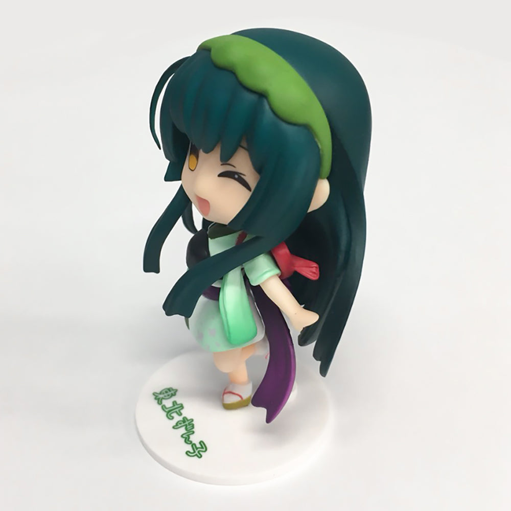 Chibi-style anime figure of Tohoku Zunko with teal hair green headband and light green kimono winking playfully
