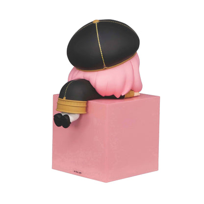 Spy x Family Hikkake Anya Forger figure sitting on pink block with black and yellow outfit and pink hair
