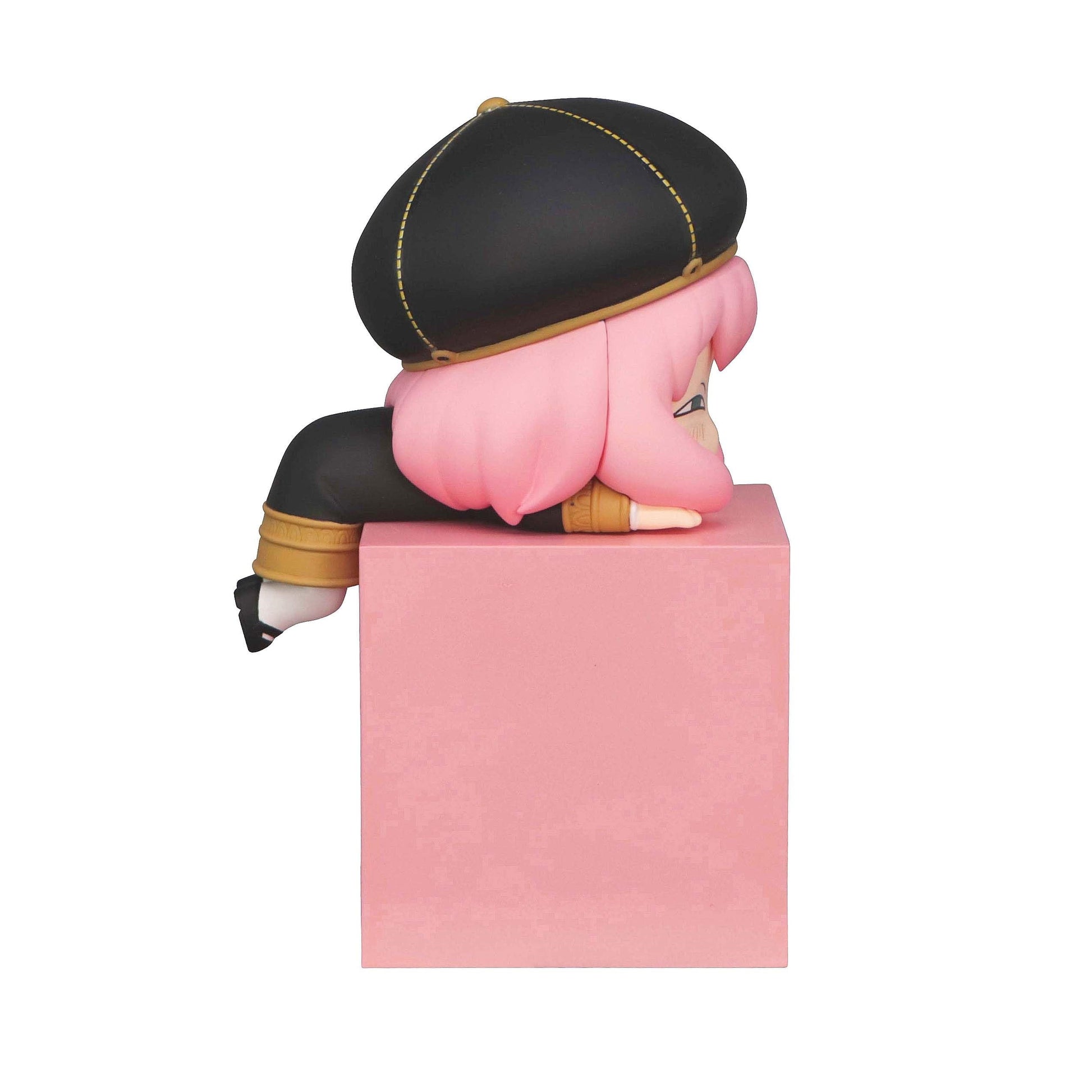 Spy x Family Hikkake Anya Forger figure in black cap and dress sitting on a pink block