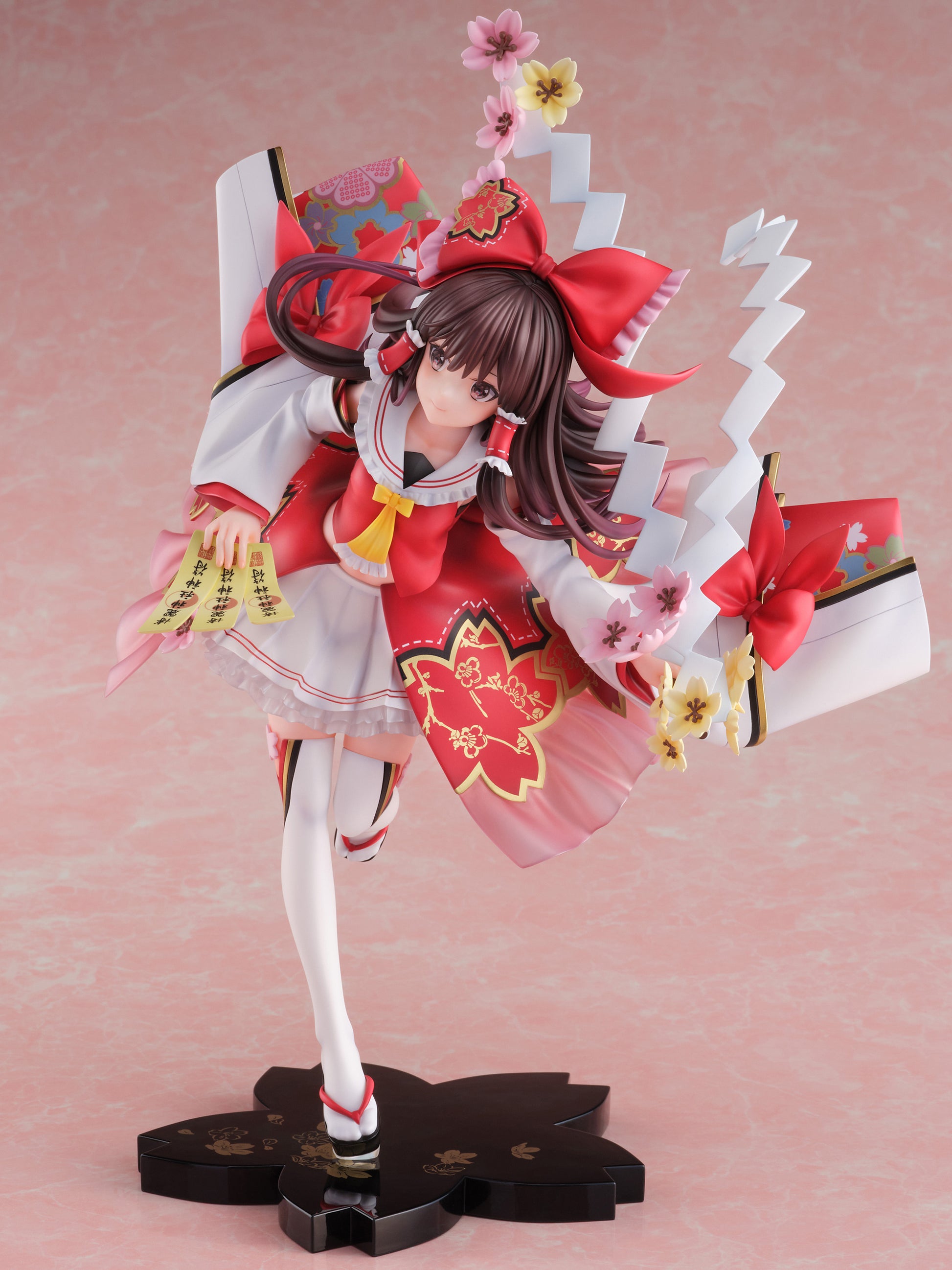 Touhou Project Reimu Hakurei figure in miko outfit with cherry blossoms and talisman papers on a black sakura base