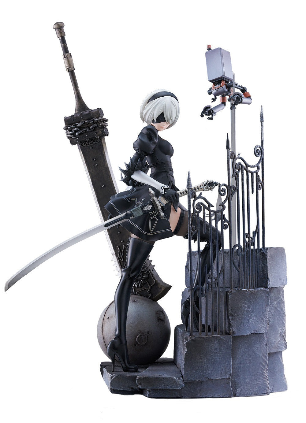 Blindfolded 2B figure in black, holding a katana, stands on ruins with a massive sword and small robot