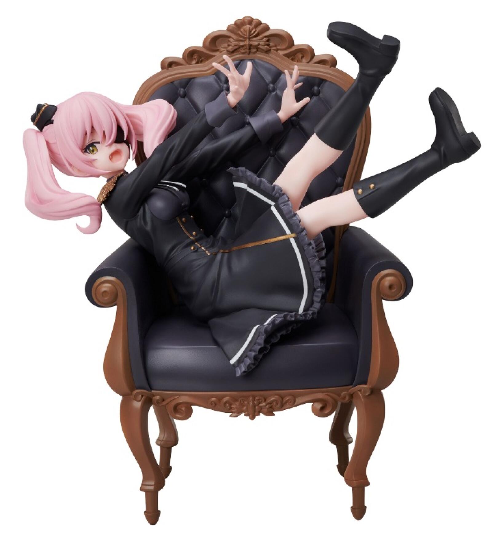 Annett 1:7 scale figure in seated pose holding a book