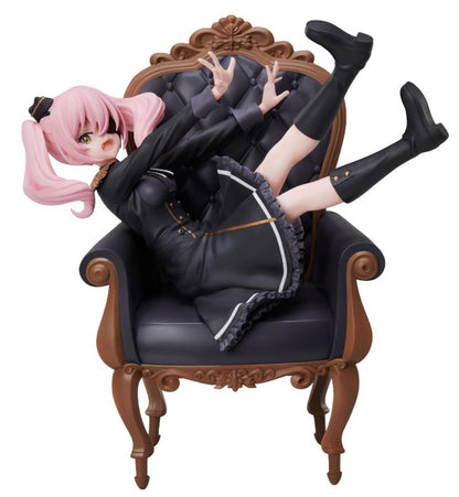 Annett 1:7 scale figure in seated pose holding a book