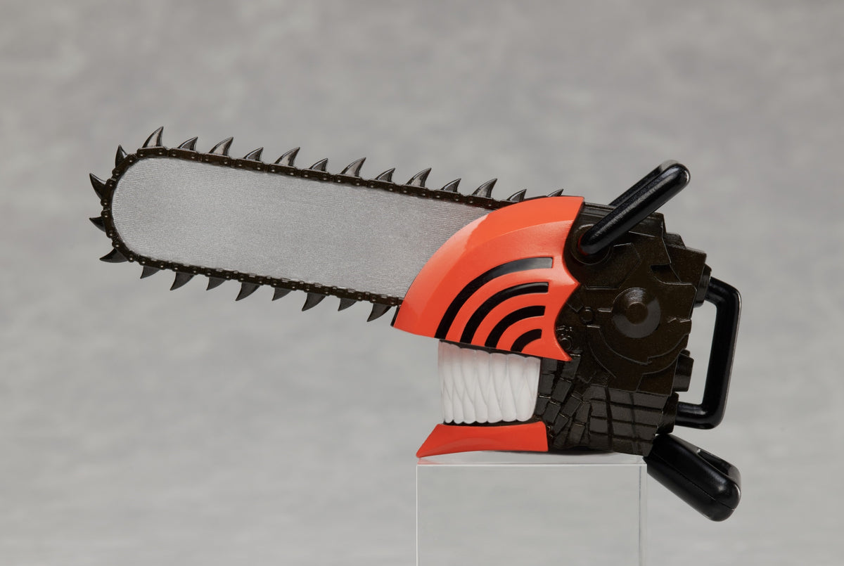 Chainsaw Man miniature figure head with gray chainsaw blade black and orange casing and white teeth