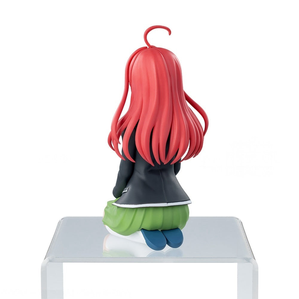 The Quintessential Quintuplets PM Perching Itsuki Nakano figure viewed from the back with red hair black jacket and green skirt sitting on a clear riser