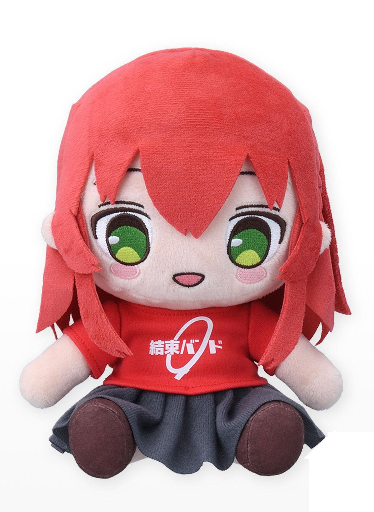 Red plush doll with short hair green eyes wearing a red shirt with Japanese text and a gray skirt