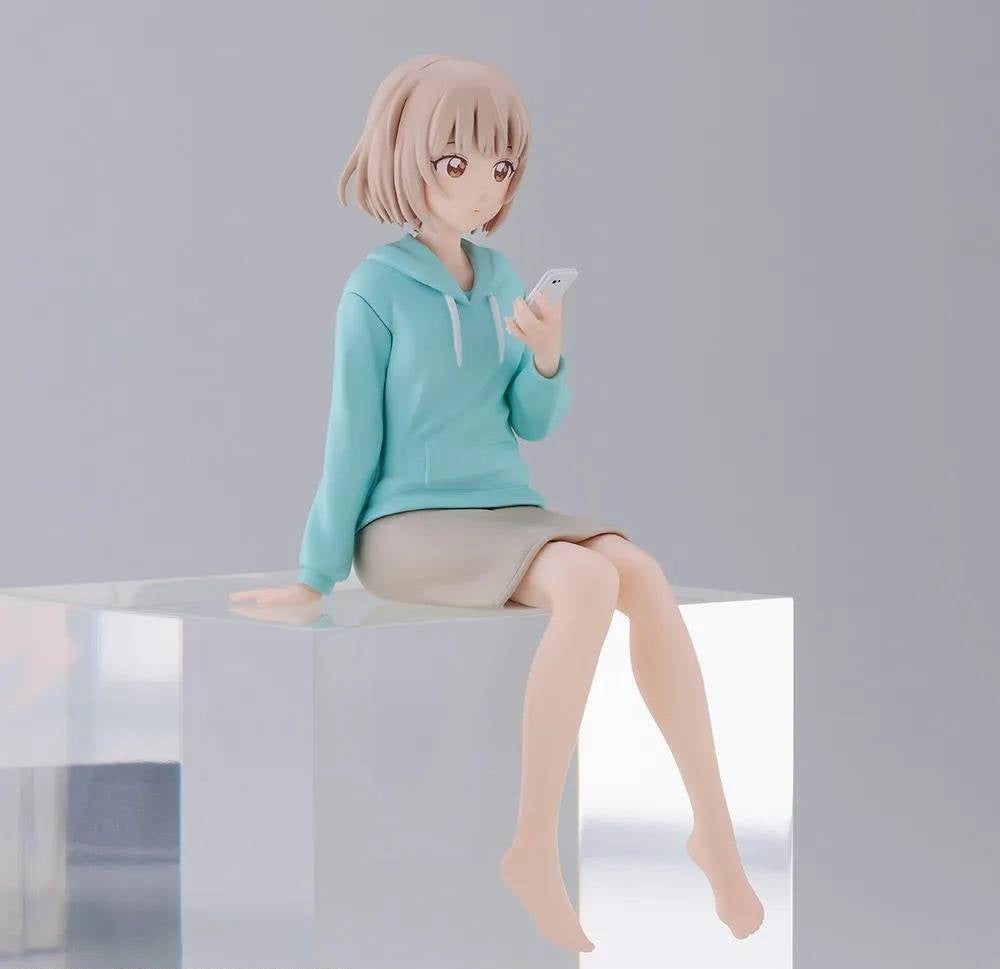 Ohmuro Family PM perching figure Nadeshiko Ohmuro in blue hoodie and tan skirt sitting on clear block browsing phone