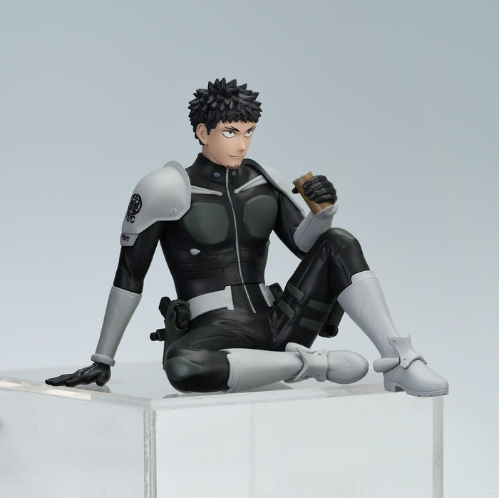 Figure from Kaiju No 8 in black and gray uniform holding a drink