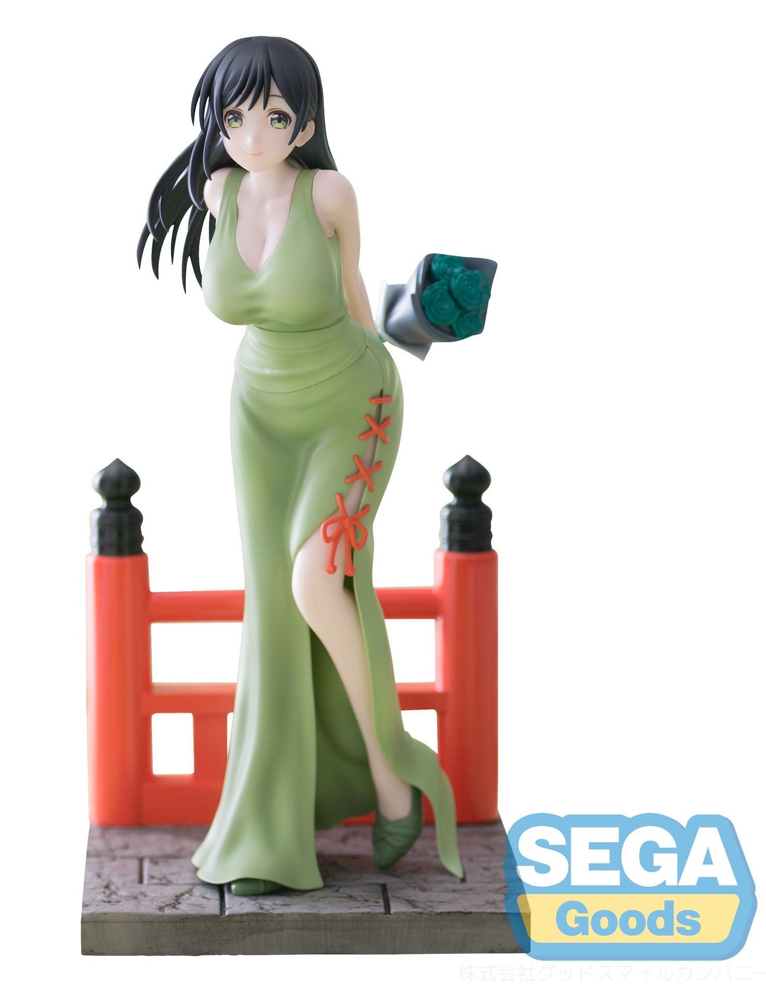 Anime figure in a sage green dress with orange lacing, holding green roses
