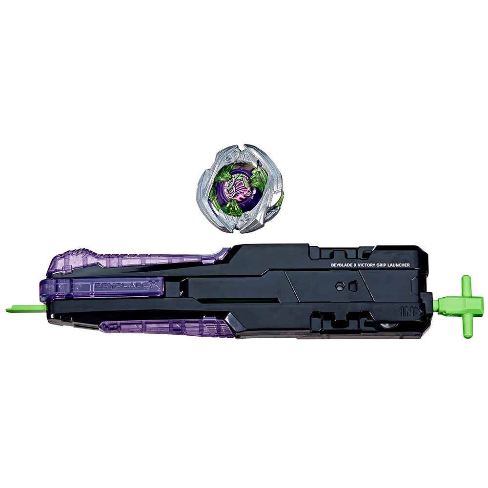 Beyblade X spinning top (metallic green/silver) and a long black/purple Victory Grip Launcher