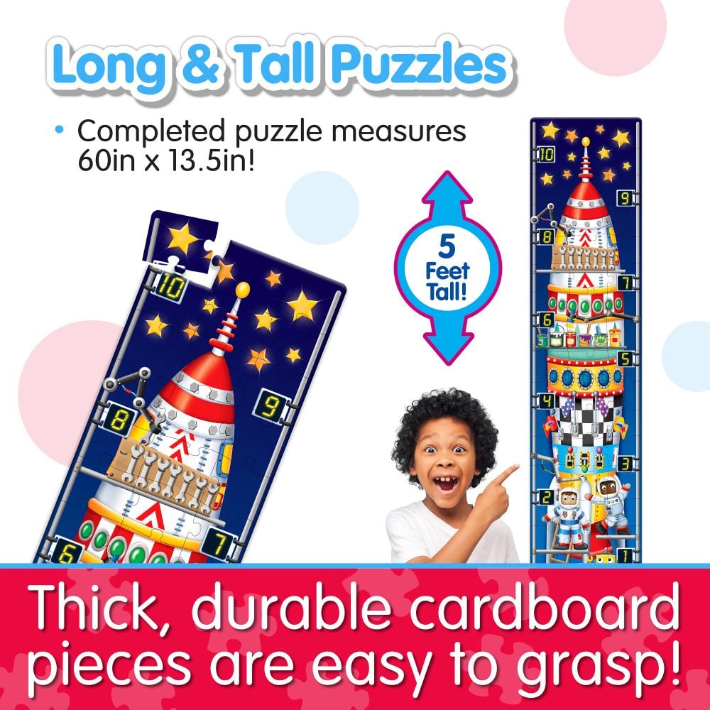 Excited child pointing to a 5-foot-tall vertical space rocket jigsaw puzzle made of thick, durable cardboard pieces