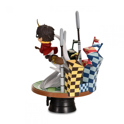 Side view of Harry Potter Quidditch Match figurine mid-air on broom with Quidditch goalpost