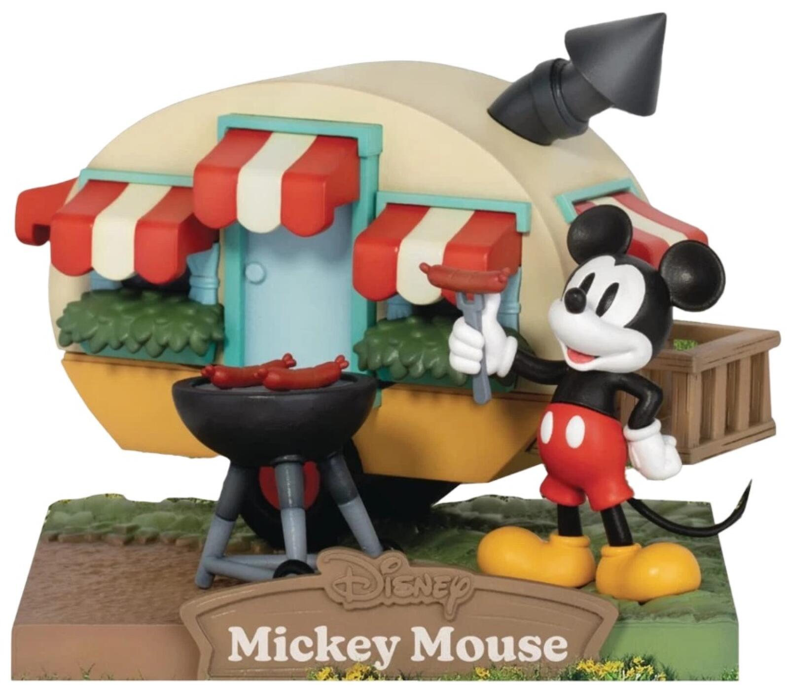 Mickey Mouse figure sitting on a camping chair with backpack and campfire on base