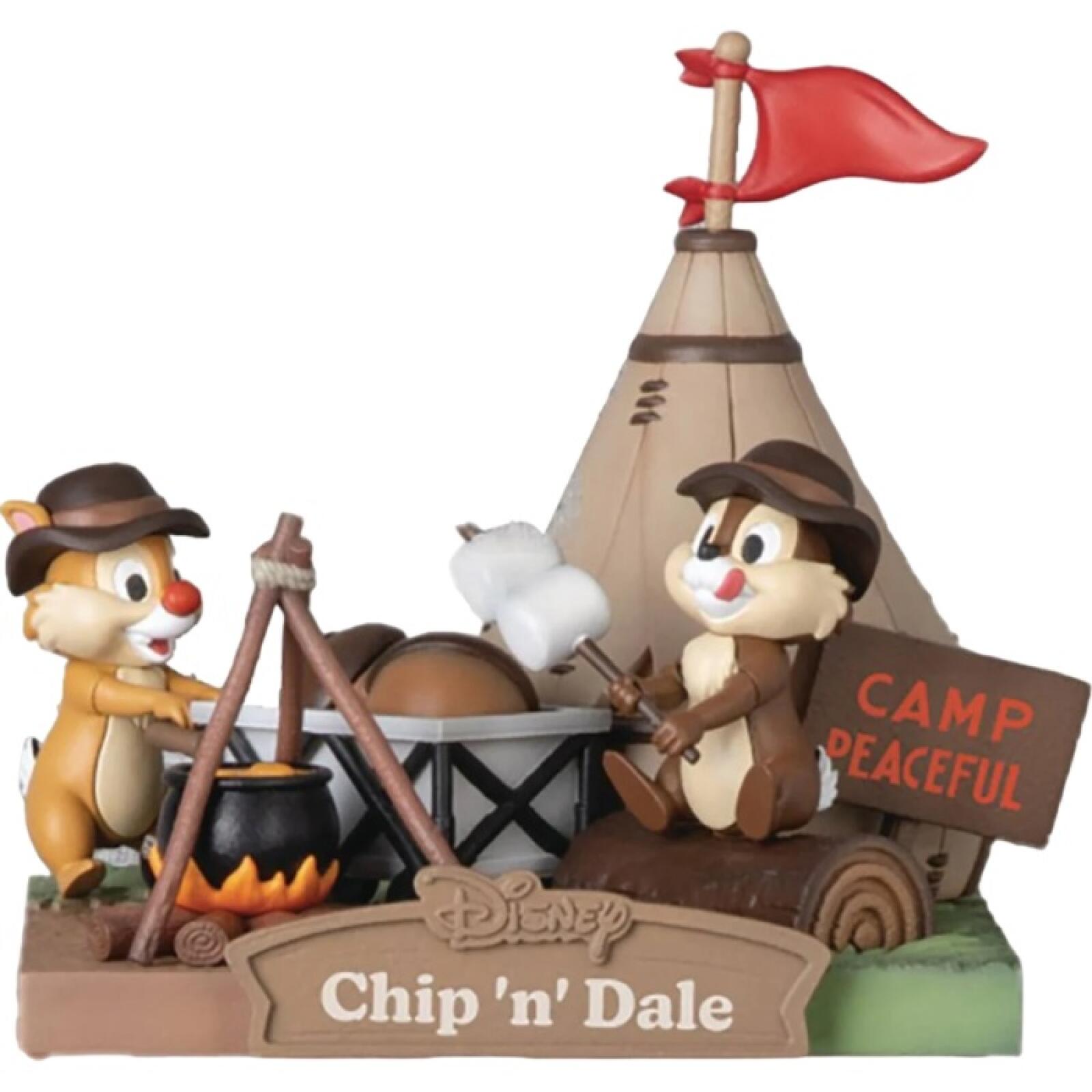 Chip and Dale figure roasting marshmallows on a campfire base, with detailed grass and log textures