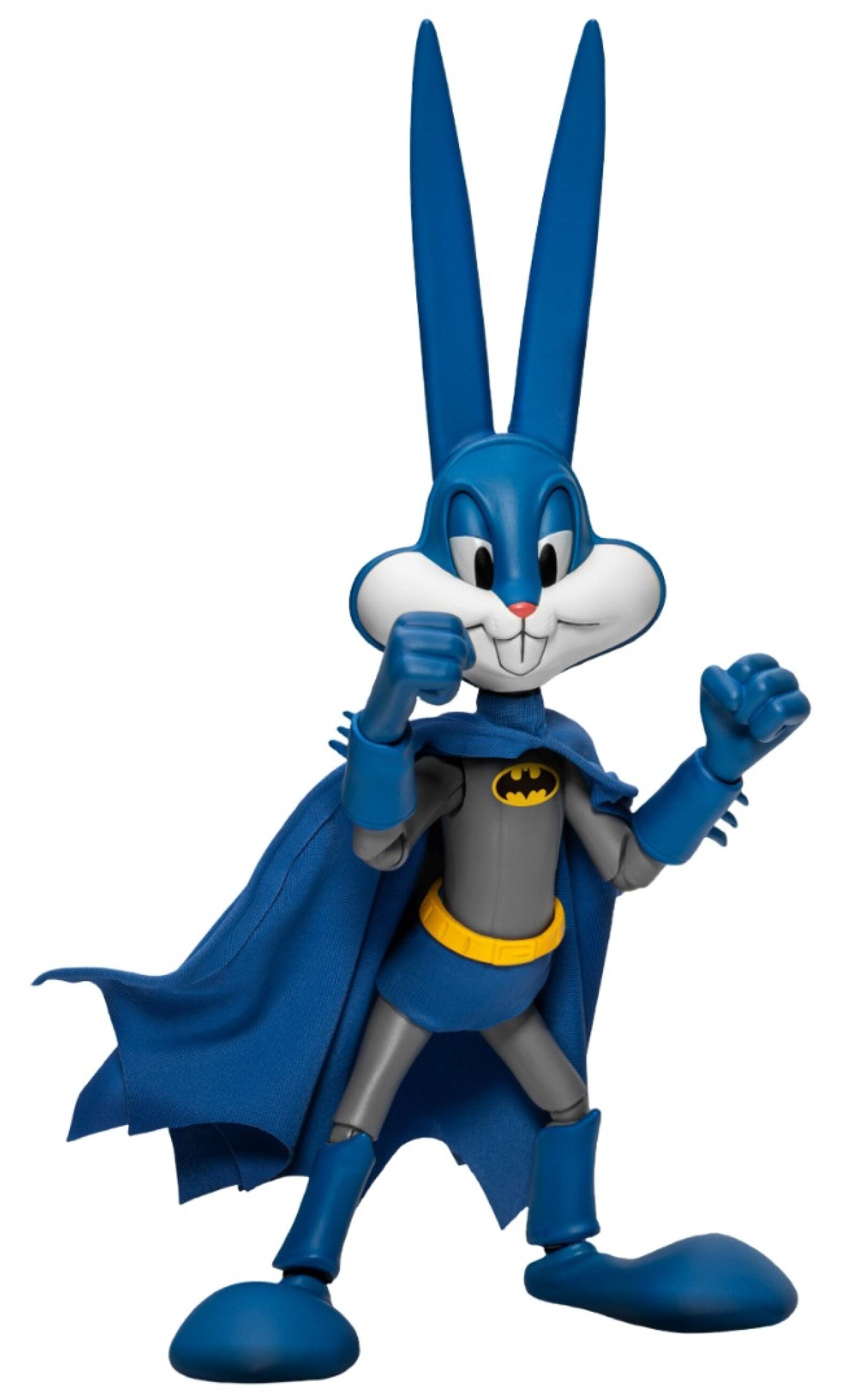 Bugs Bunny dressed as Batman standing on a rooftop base with spotlight and bat signal