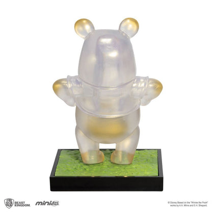 Iridescent clear Mini Egg Attack MEA-013 Winnie the Pooh figure with gold ear and paw details on a green and black base