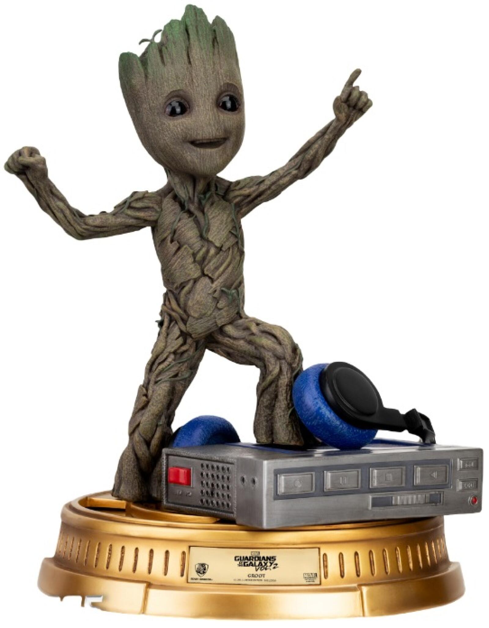 Groot life-size statue in royal attire with crown and golden scepter