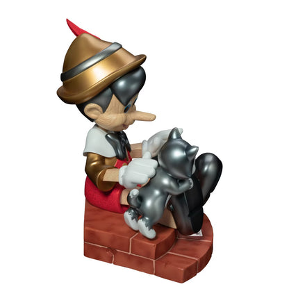 Pinocchio and Figaro cat figurine on a brick chimney base gold red and gray accents