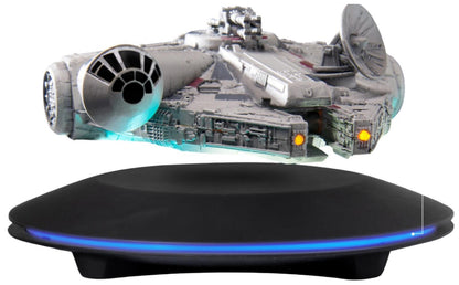 Star Wars Millennium Falcon EAF-003 floating model with light-up function displayed on a black base with blue glow