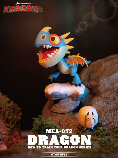 Beast Kingdom's Mini Egg Attack Stormfly figure, a blue and yellow dragon with its mouth wide open, stands menacingly on a detailed rocky base