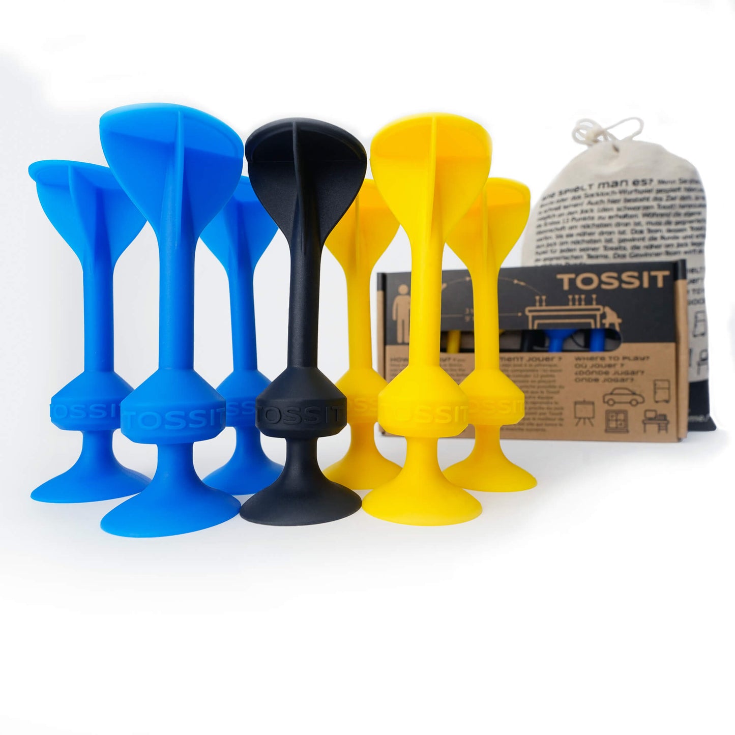 Seven colorful silicone suction darts from the Tossit Starter Pack are arranged with three blue, three yellow, and one black piece visible next to the product packaging and cloth bag