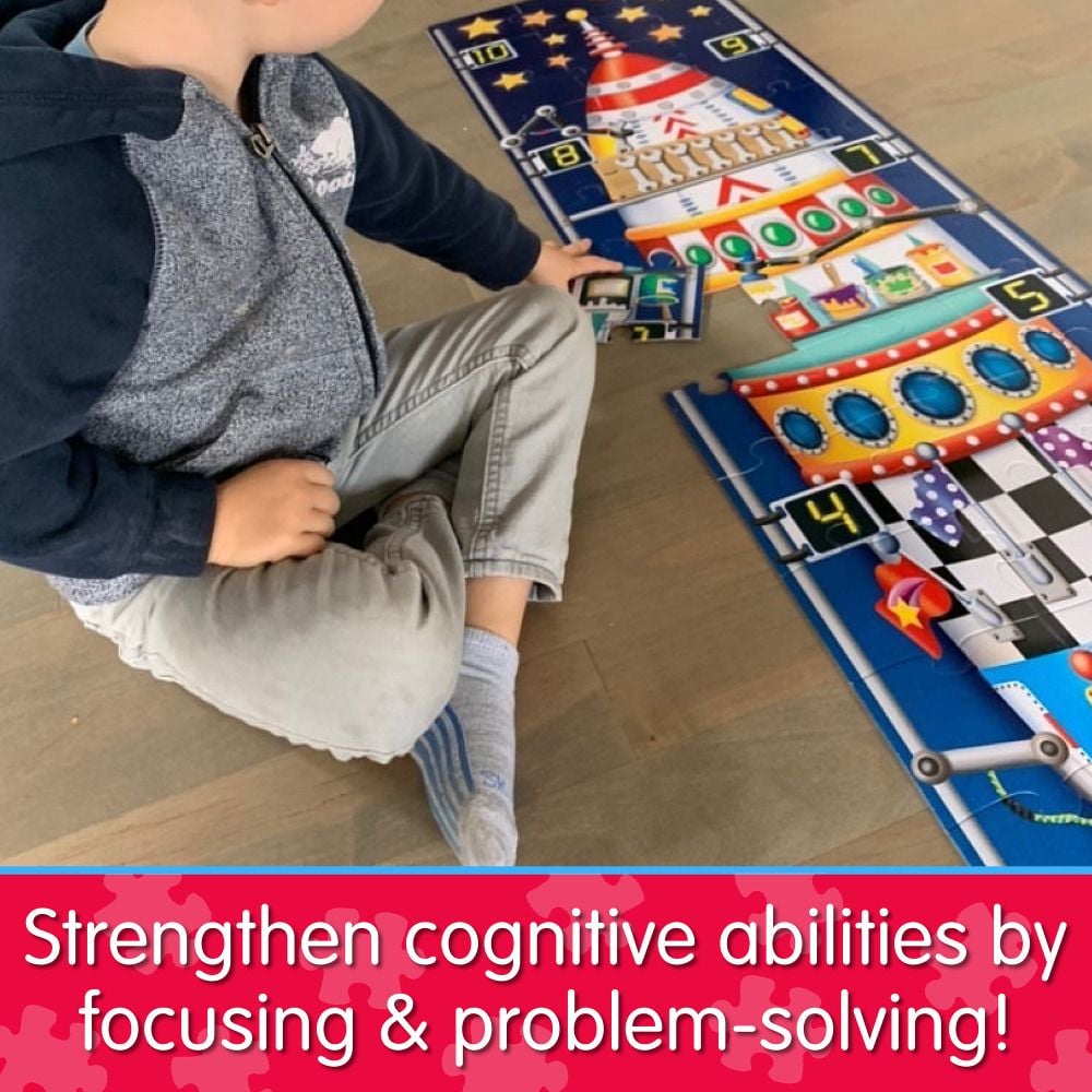 Child assembling a numbered rocket ship floor puzzle on the floor, engaging in educational play