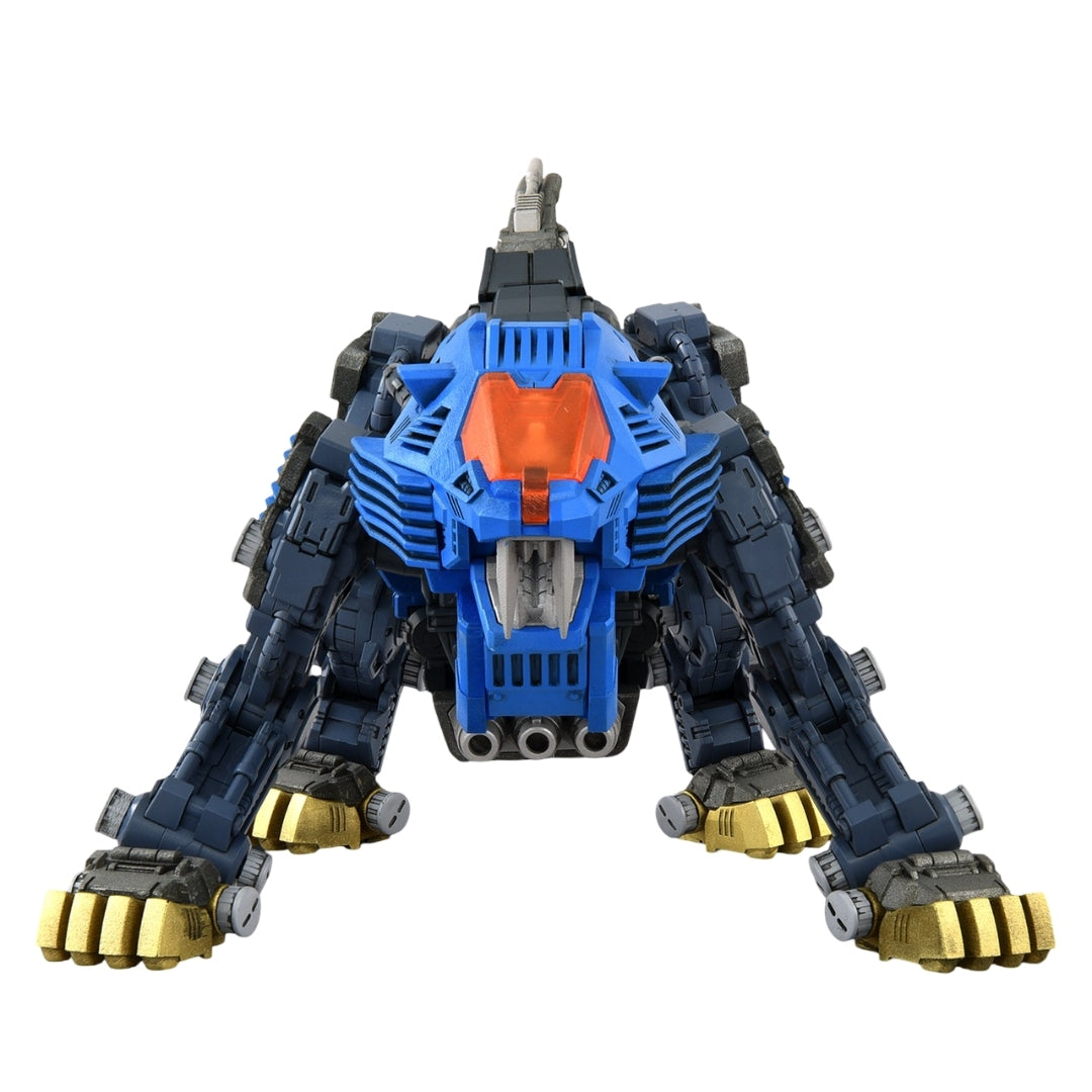 The detailed Zoids Shield Liger model is captured head-on in an aggressive stance, highlighting its vibrant blue face, orange cockpit, and massive golden claws