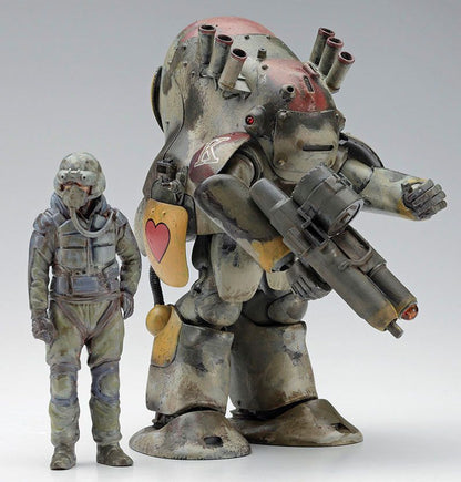 Weathered sci-fi scale models: a pilot standing next to a large, rounded mech holding a weapon