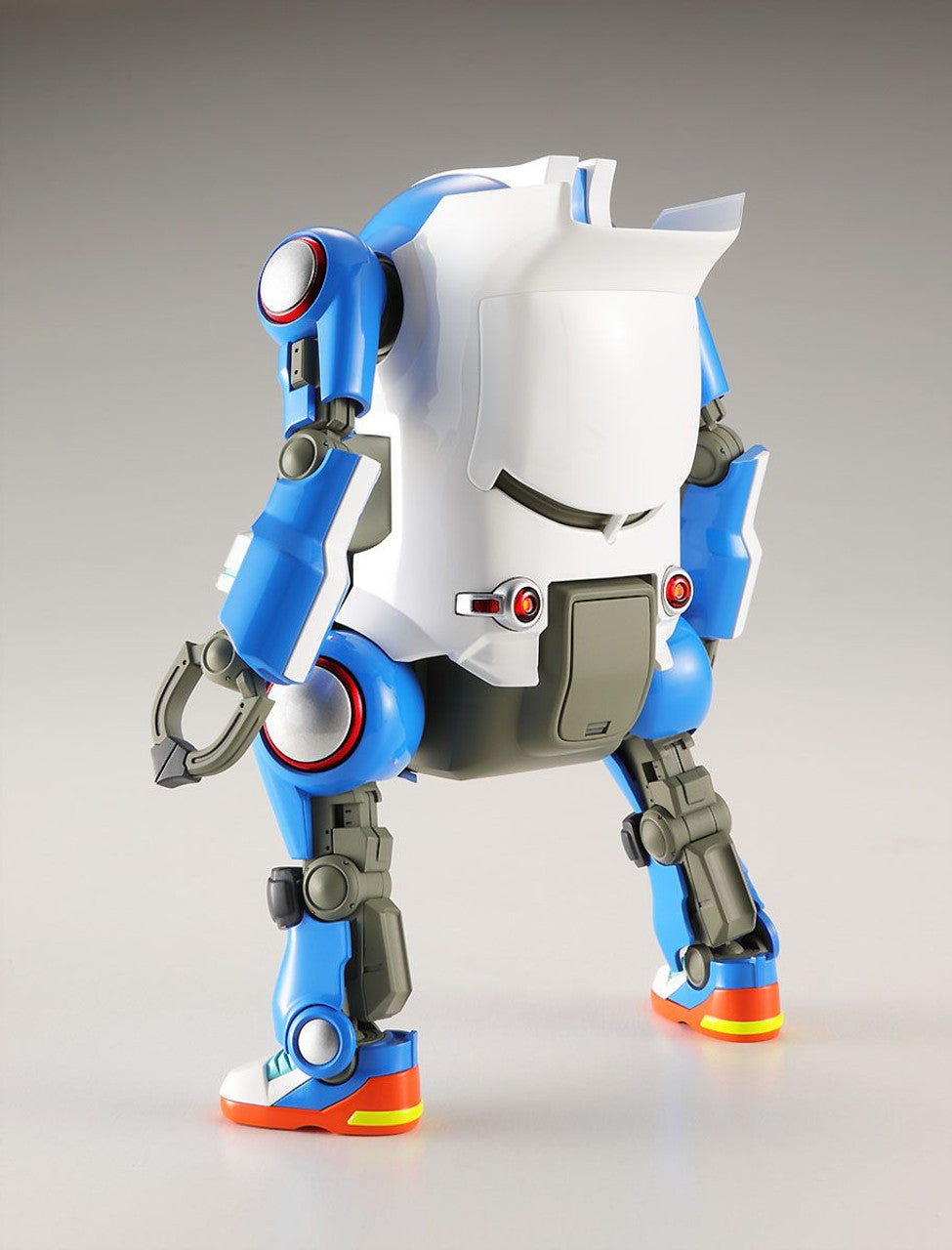 Articulated blue and white robot model, viewed from the back, standing on bright sneaker-style feet