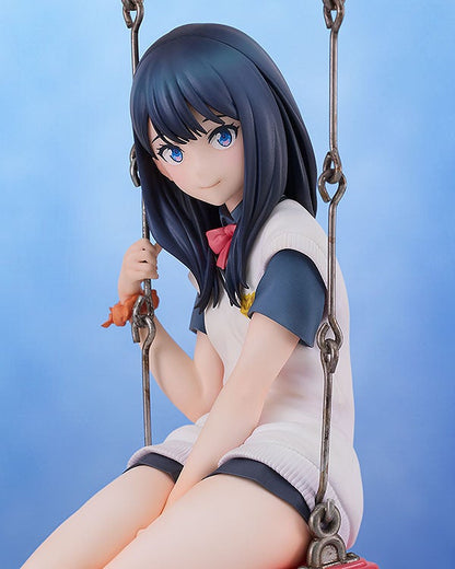 Anime girl figure with blue hair and eyes in white shirt and skirt on a swing