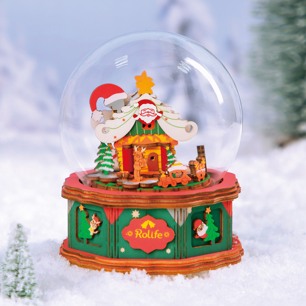 Detailed wooden Christmas snow globe kit depicting Santa's workshop in a snowy scene