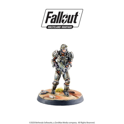 Fallout Wasteland Warfare miniature: Armored soldier in a helmet, holding a rifle, on a rocky terrain base